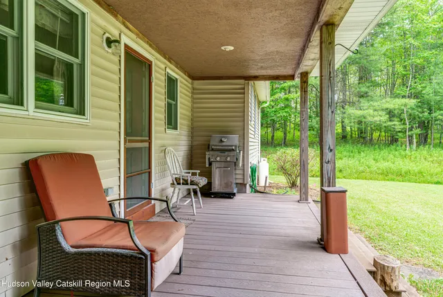 a bathroom with a granite countertop toilet sink and mirror