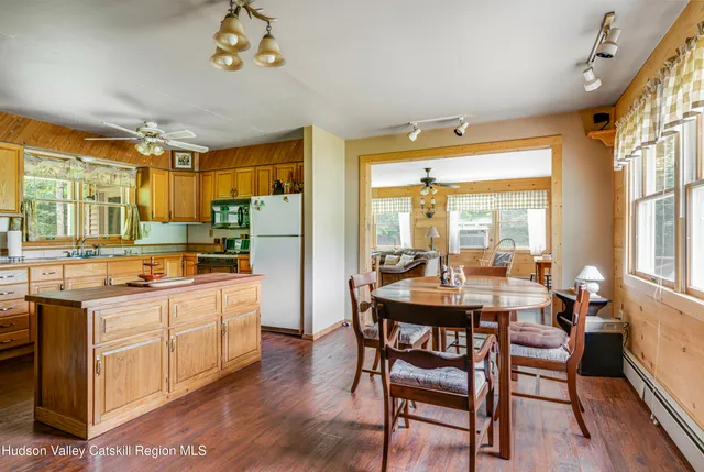 a kitchen with sink refrigerator and stove