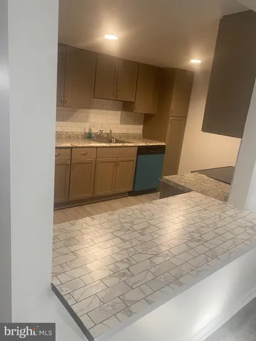 a view of kitchen with wooden floor