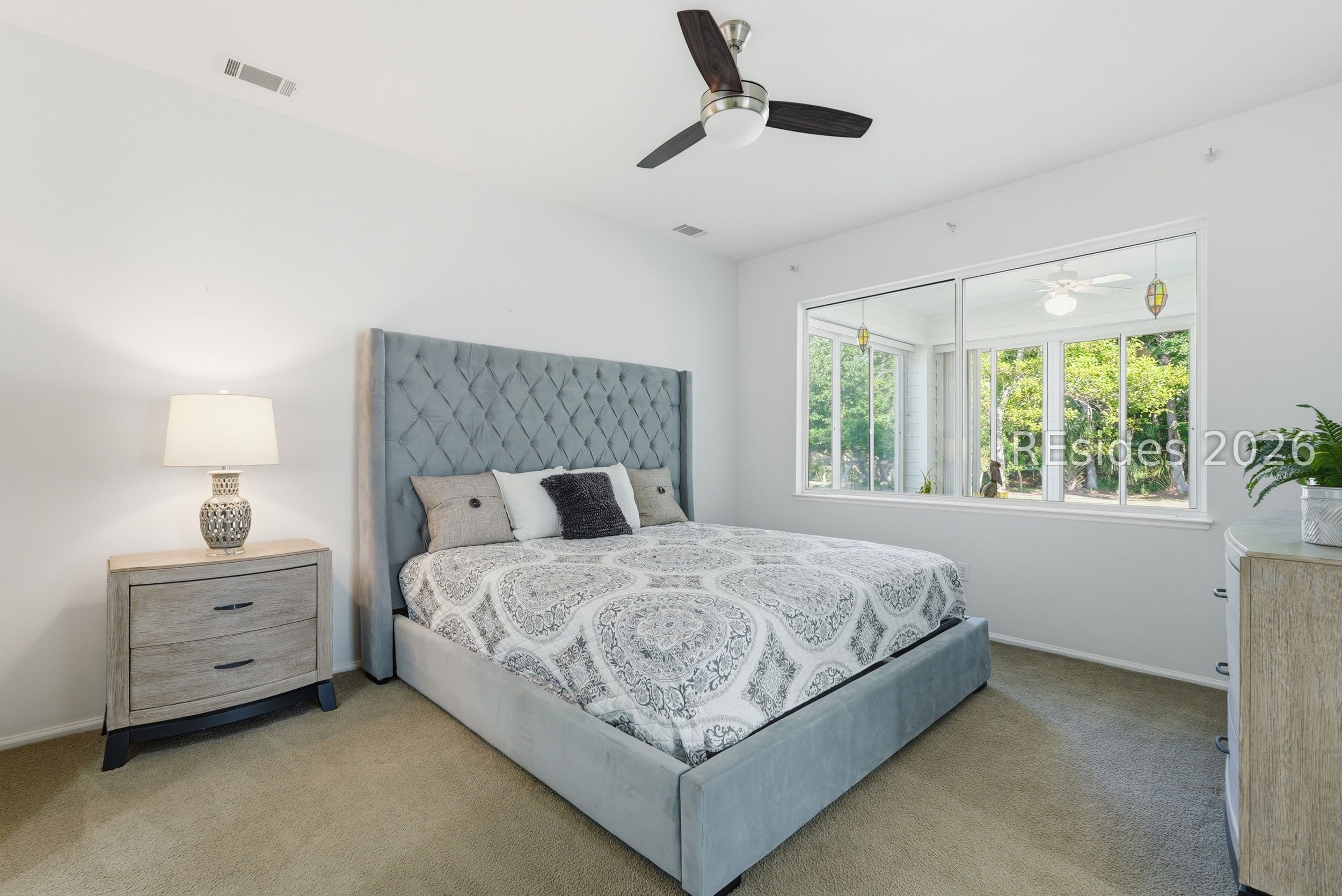 105 Colonel Colcock Court Bluffton, SC 29909 - Photo 22 of 56 Primary bedroom with a calm, airy atmosphere.