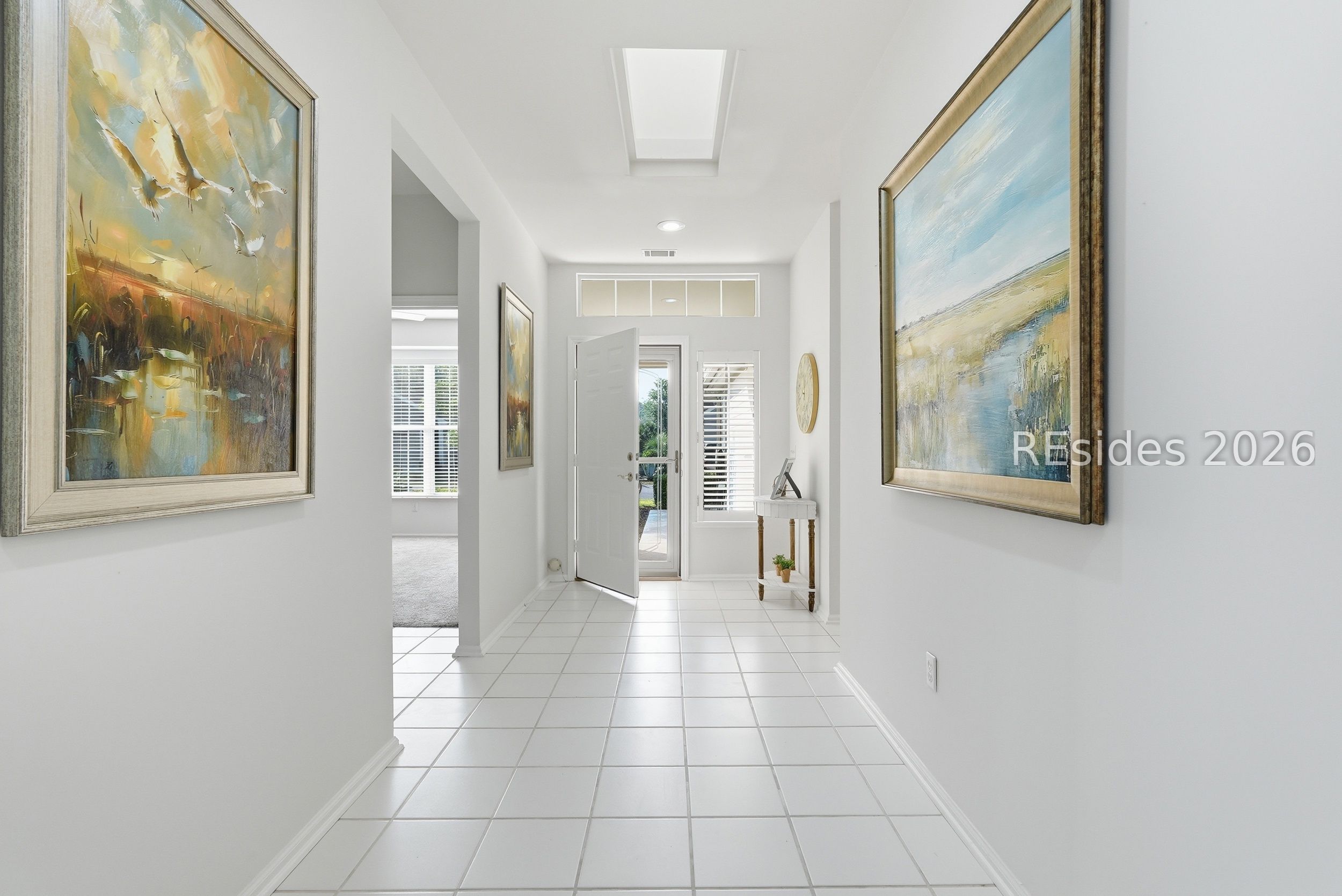 105 Colonel Colcock Court Bluffton, SC 29909 - Photo 6 of 56 Light-filled foyer with skylight above.