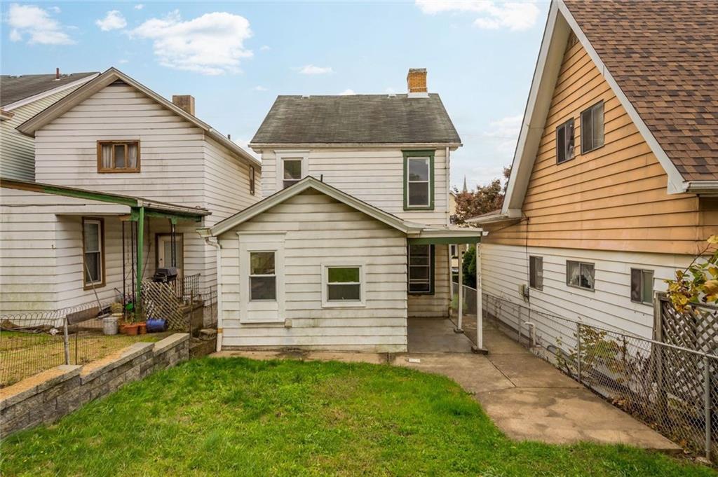 916 2nd Street McKees Rocks, PA 15136 - Photo 12 of 26 a view of a white house with a yard and furniture
