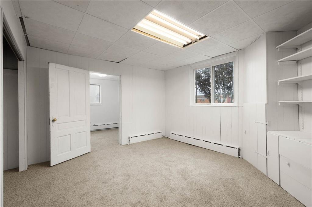 916 2nd Street McKees Rocks, PA 15136 - Photo 13 of 26 an empty room with windows and closet