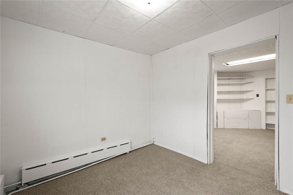 916 2nd Street McKees Rocks, PA 15136 - Photo 17 of 26 an empty room with a bench