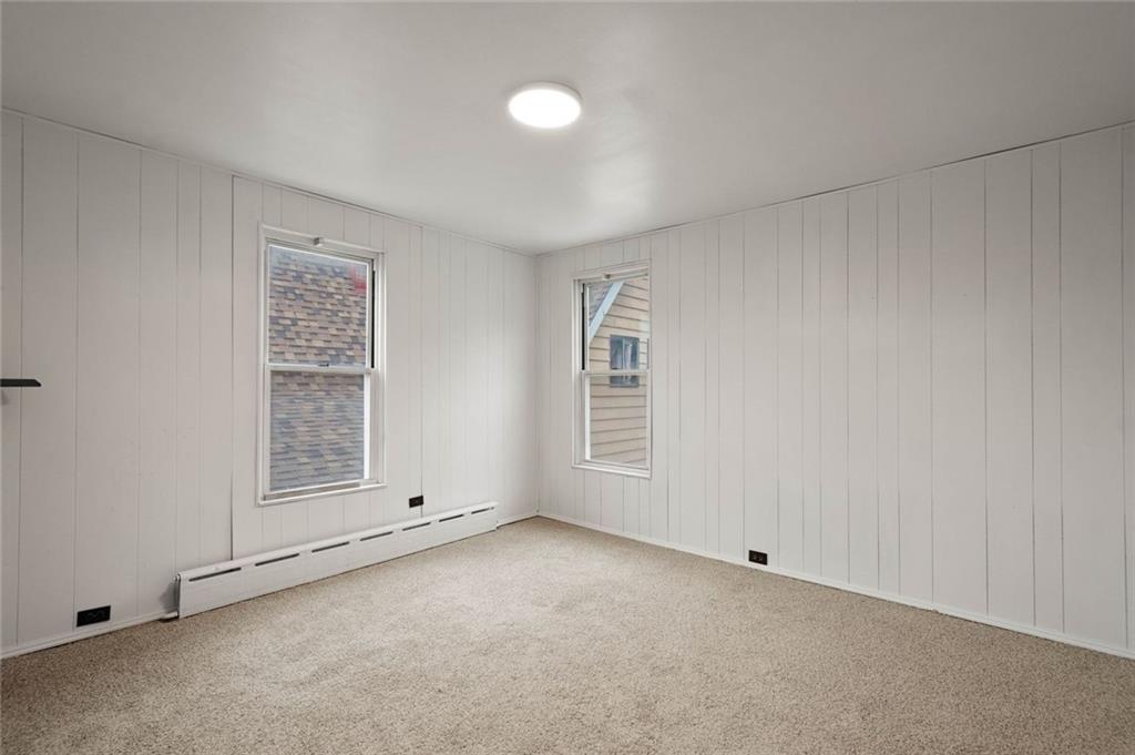 916 2nd Street McKees Rocks, PA 15136 - Photo 22 of 26 an empty room with a empty space and windows