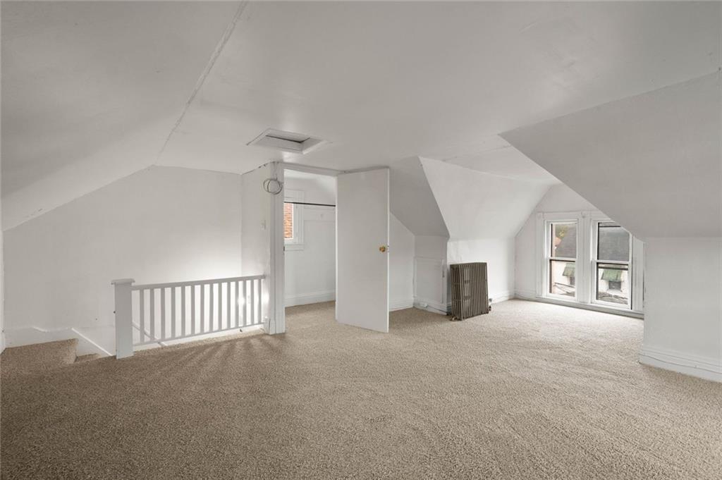 916 2nd Street McKees Rocks, PA 15136 - Photo 24 of 26 an empty room with windows and fireplace