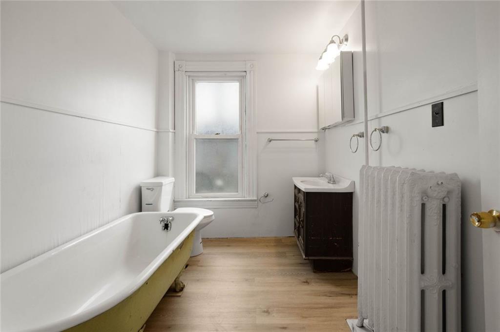 916 2nd Street McKees Rocks, PA 15136 - Photo 25 of 26 a bathroom with a bathtub and a shower
