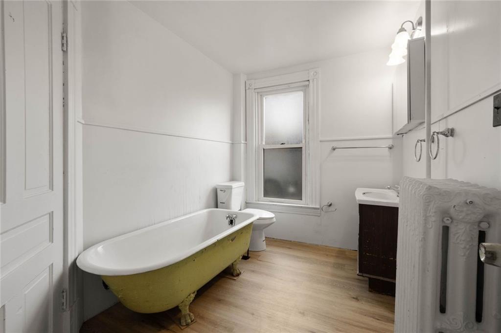 916 2nd Street McKees Rocks, PA 15136 - Photo 26 of 26 a bathroom with a tub sink and shower