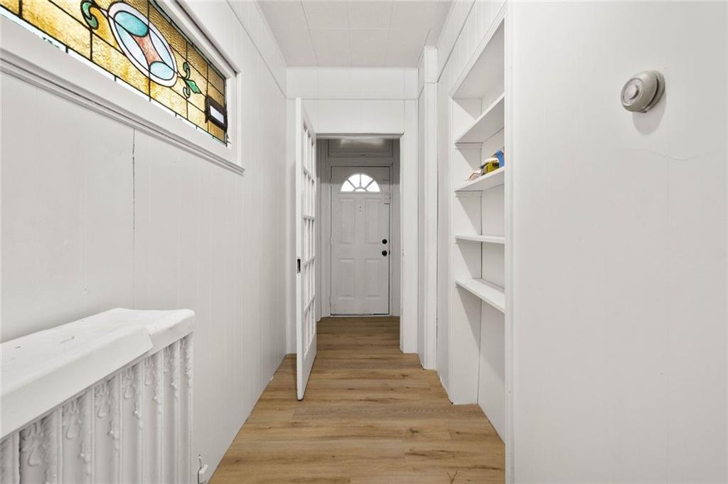 916 2nd Street McKees Rocks, PA 15136 - Photo 3 of 26 a view of a hallway with wooden floor and entryway