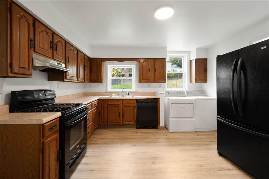 916 2nd Street McKees Rocks, PA 15136 - Photo 6 of 26 a kitchen with a sink stove and refrigerator