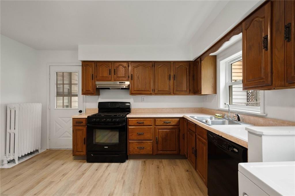 916 2nd Street McKees Rocks, PA 15136 - Photo 7 of 26 a kitchen with a sink stove and cabinets