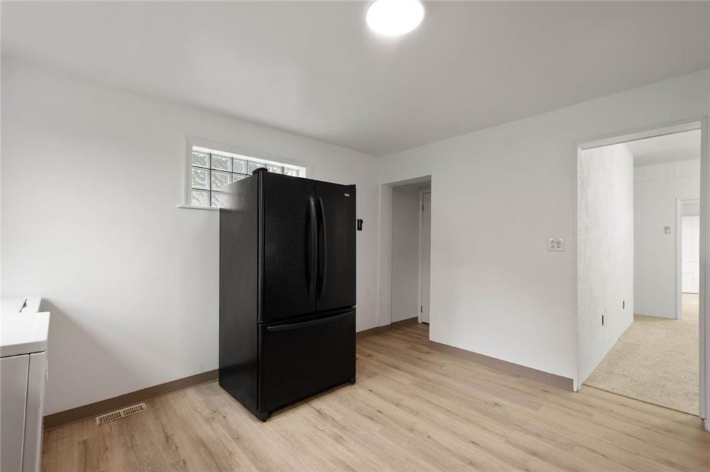916 2nd Street McKees Rocks, PA 15136 - Photo 9 of 26 an empty room with wooden floor