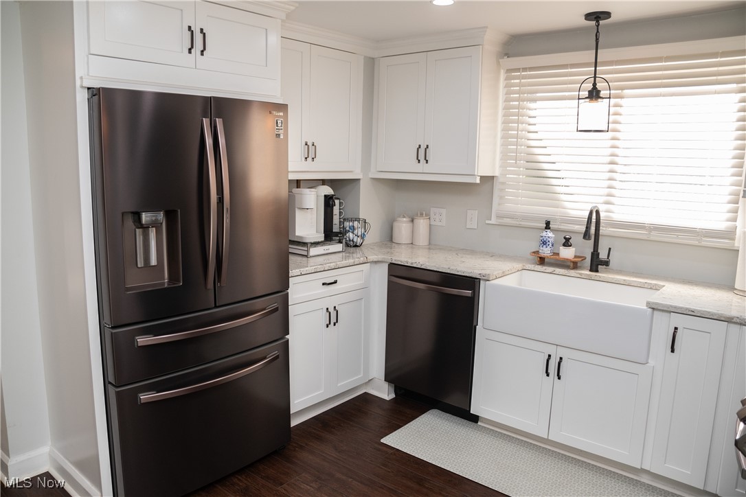95 Clingan Road Struthers, OH 44471 - Photo 20 of 46 Kitchen featuring stainless steel fridge, light stone counters, white cabinetry, pendant lighting, and recessed lighting