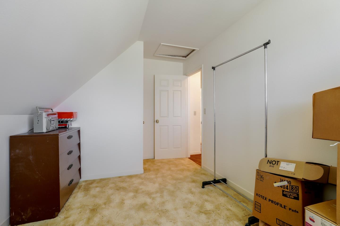 22110 Ranchito Drive Salinas, CA 93908 - Photo 13 of 33 a bedroom with a bed and cabinets