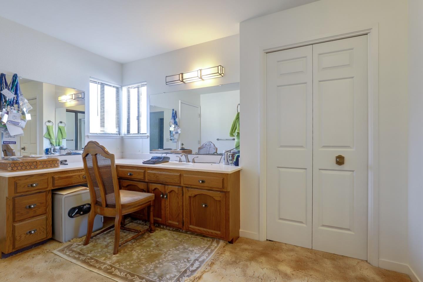 22110 Ranchito Drive Salinas, CA 93908 - Photo 15 of 33 a spacious bathroom with a double vanity sink and a mirror