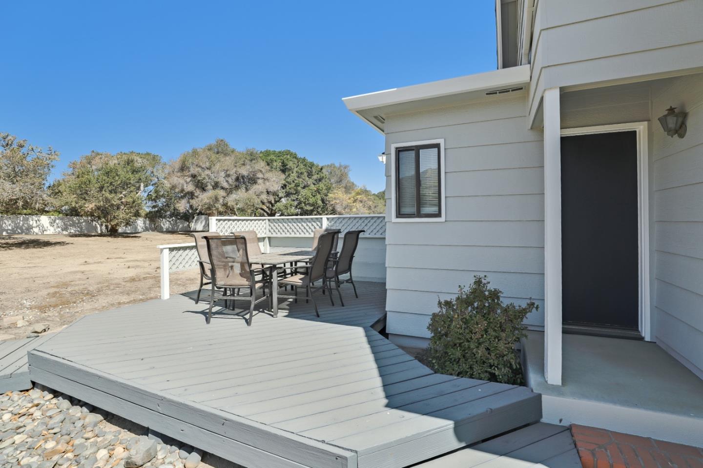 22110 Ranchito Drive Salinas, CA 93908 - Photo 20 of 33 a view of a patio with table and chairs and potted plants with wooden floor