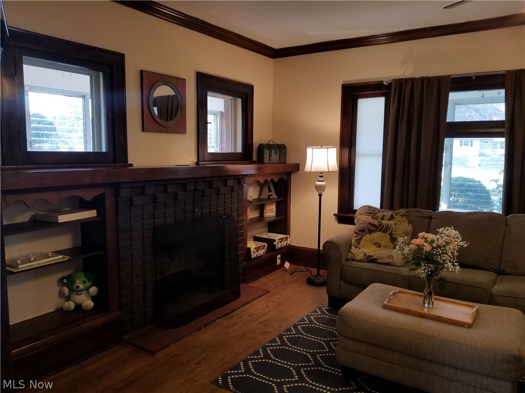 3424 Greenwich Road Norton, OH 44203 - Photo 2 of 22 Stunning stacks brick fireplace flanked by built in bookshelves.