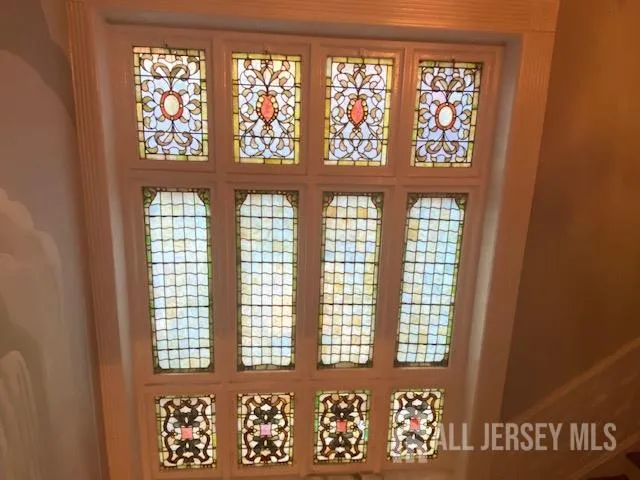a living room with furniture and a large mirror