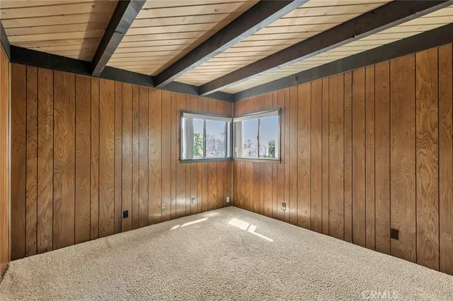 a view of a livingroom with wooden walls