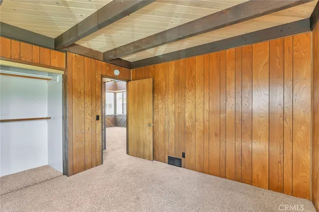 a view of a room with large windows