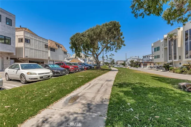 a view of a yard with cars