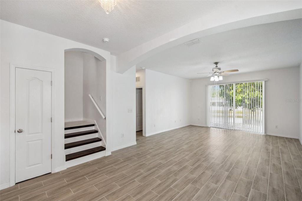 12351 Ridgedale Drive Hudson, FL 34669 - Photo 13 of 54 wooden floor in an empty room with a window