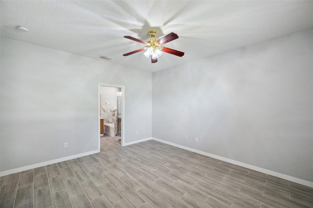 12351 Ridgedale Drive Hudson, FL 34669 - Photo 21 of 54 wooden floor in an empty room