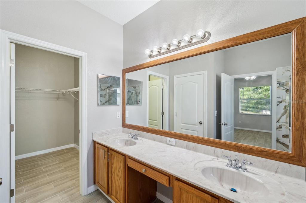 12351 Ridgedale Drive Hudson, FL 34669 - Photo 23 of 54 a bathroom with a sink and a mirror