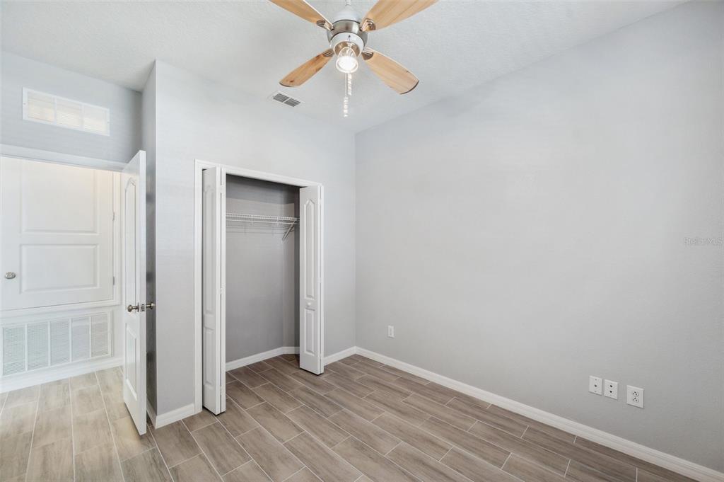 12351 Ridgedale Drive Hudson, FL 34669 - Photo 28 of 54 a view of an empty room with wooden floor