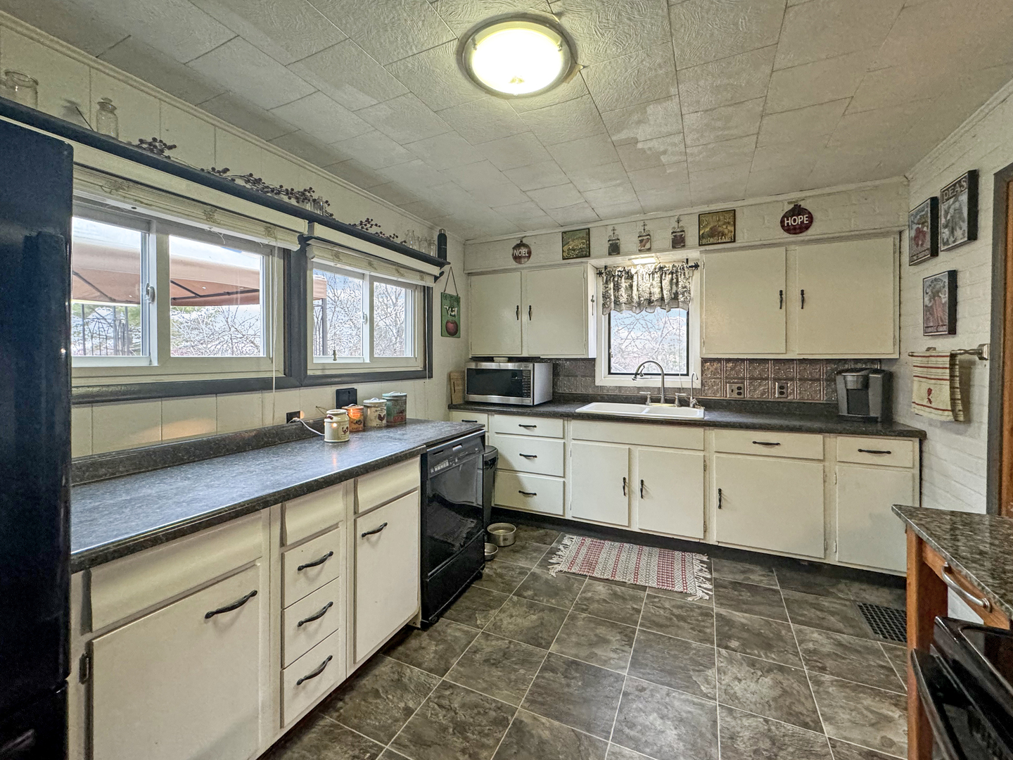2289 North AYP Road Freeport, IL 61032 - Photo 11 of 52 a kitchen with granite countertop white cabinets white appliances a sink and a window