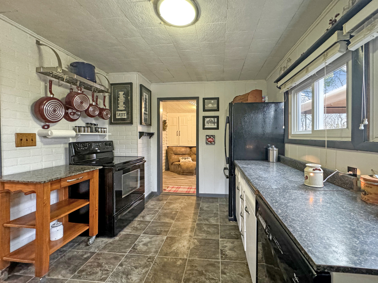 2289 North AYP Road Freeport, IL 61032 - Photo 12 of 52 a kitchen with stainless steel appliances granite countertop a sink and cabinets