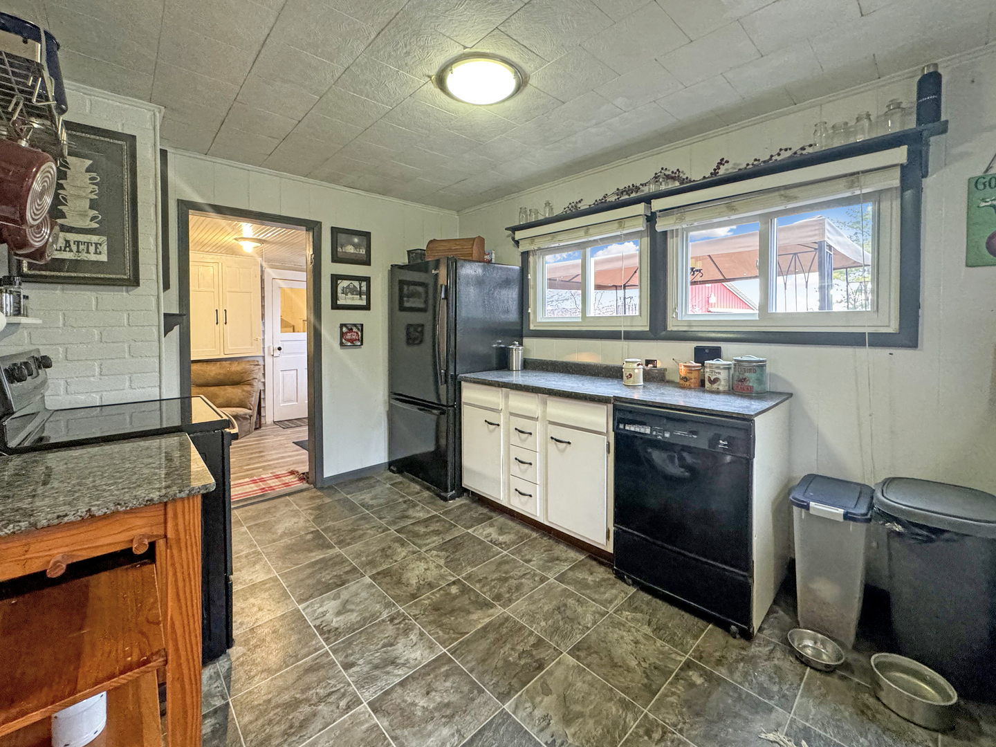 2289 North AYP Road Freeport, IL 61032 - Photo 16 of 52 a kitchen with stainless steel appliances granite countertop a stove sink and cabinets