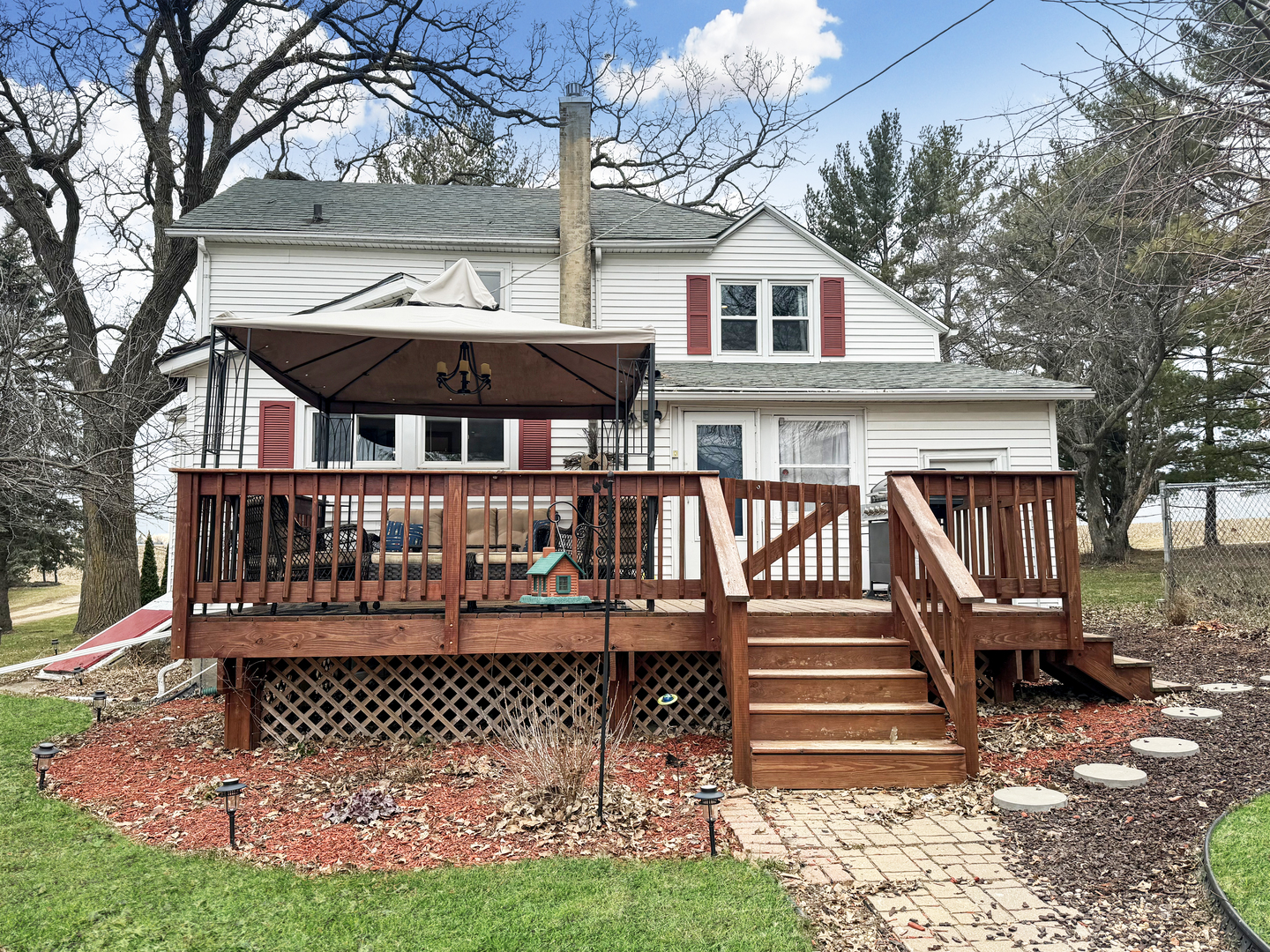 2289 North AYP Road Freeport, IL 61032 - Photo 2 of 52 a view of a house with wooden deck and a yard