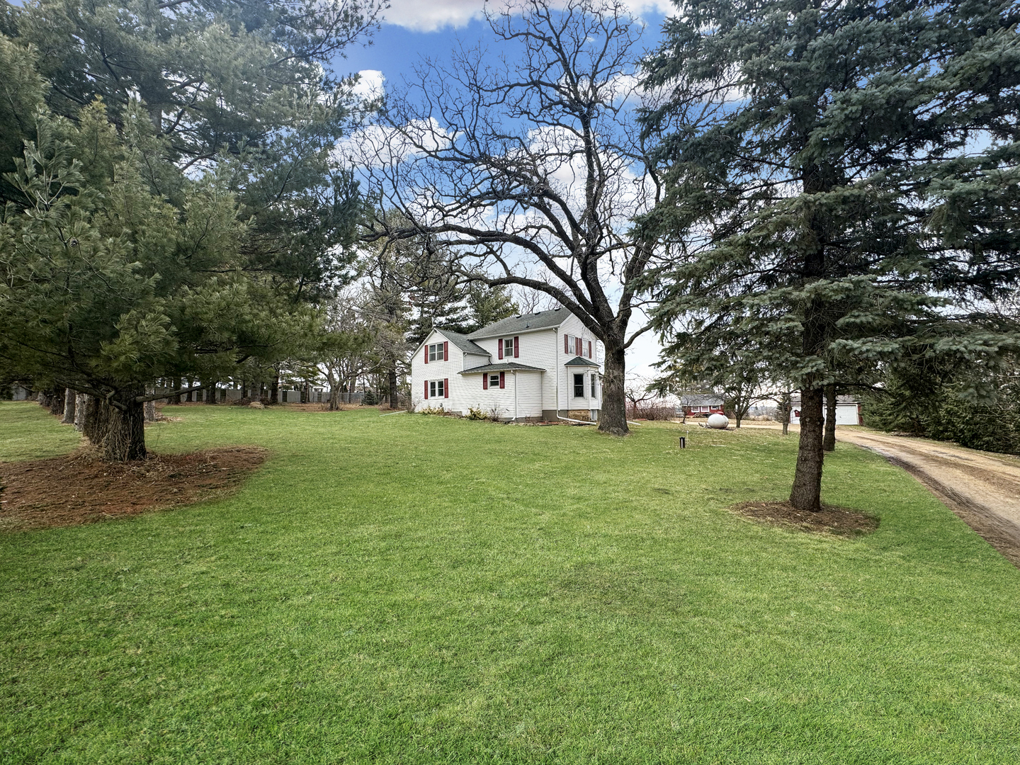 2289 North AYP Road Freeport, IL 61032 - Photo 46 of 52 a tree in the garden of a house