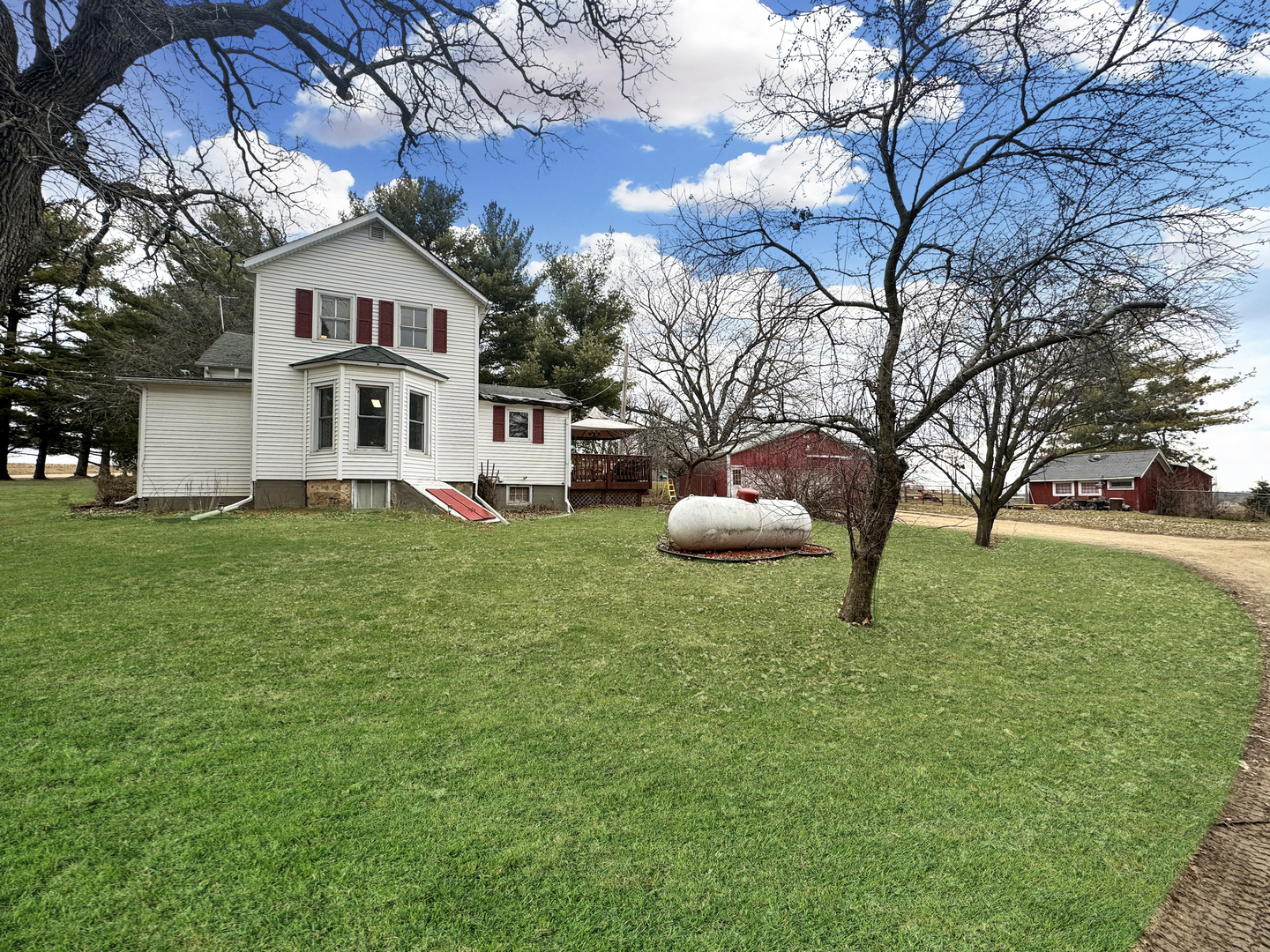 2289 North AYP Road Freeport, IL 61032 - Photo 47 of 52 a white house that has a tree in front of it