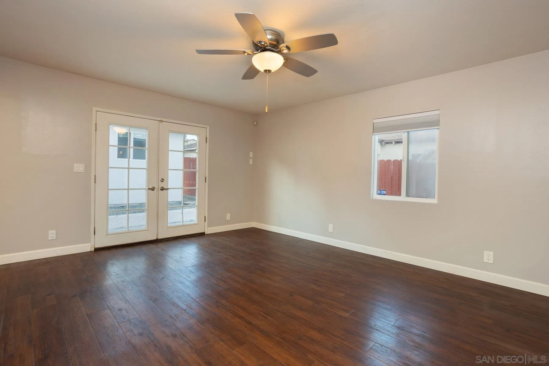 7354 Colony Road La Mesa, CA 91942 - Photo 17 of 24 a view of an empty room with window and wooden floor