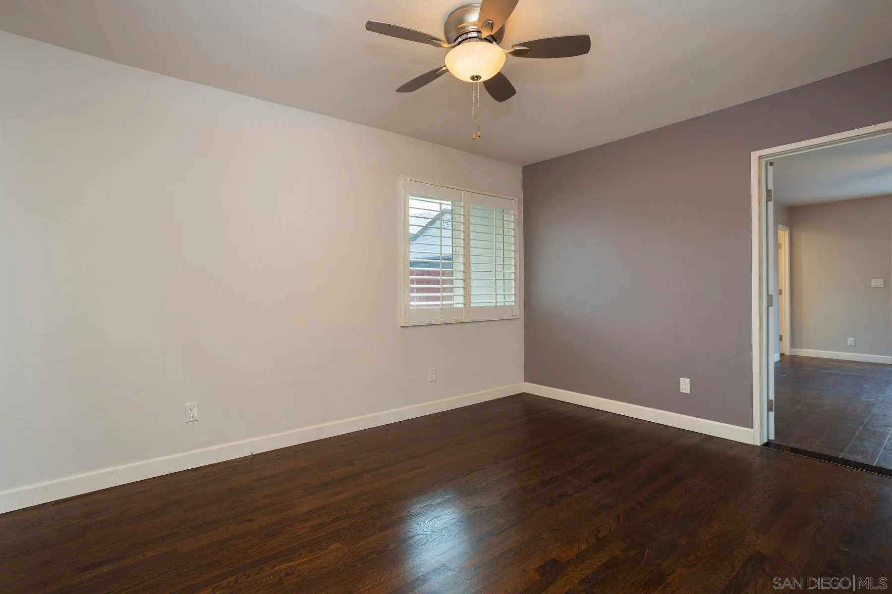 7354 Colony Road La Mesa, CA 91942 - Photo 19 of 24 a view of an empty room with wooden floor and a window