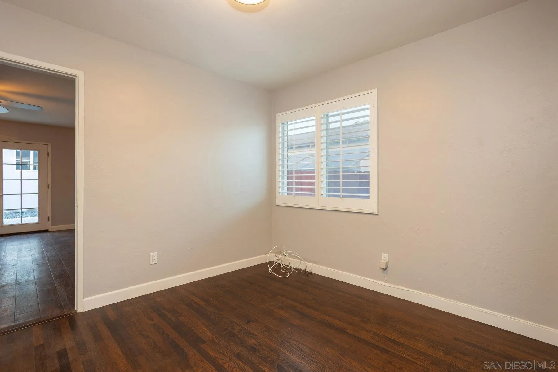 7354 Colony Road La Mesa, CA 91942 - Photo 22 of 24 an empty room with wooden floor and windows