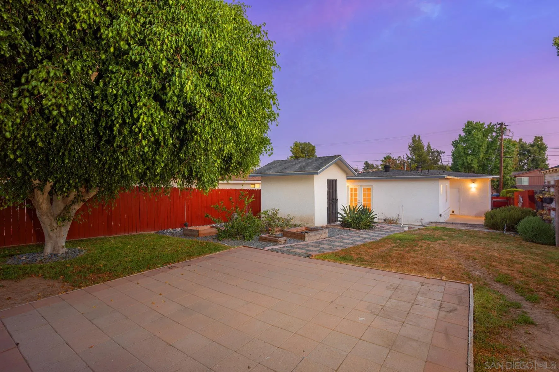 7354 Colony Road La Mesa, CA 91942 - Photo 4 of 24 a front view of a house with a yard and garage