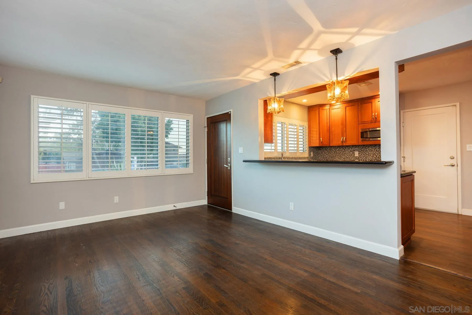 7354 Colony Road La Mesa, CA 91942 - Photo 10 of 24 a view of a room with wooden floor and a window
