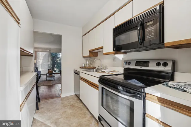 a kitchen with a stove and a microwave
