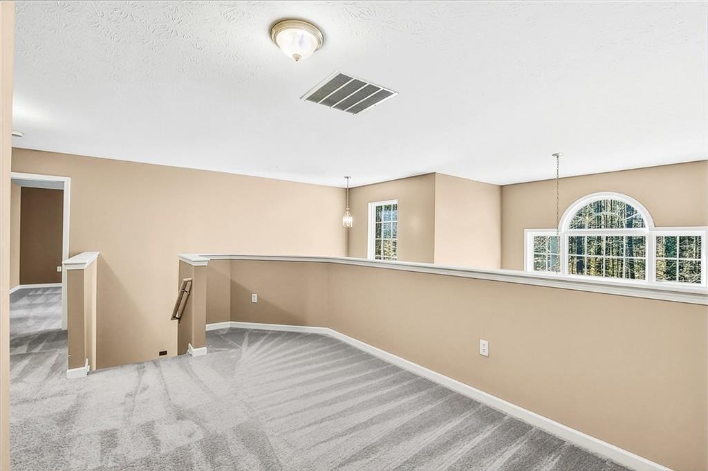 5976 Bowers Road Stone Mountain, GA 30087 - Photo 17 of 31 a view of an empty room with a window