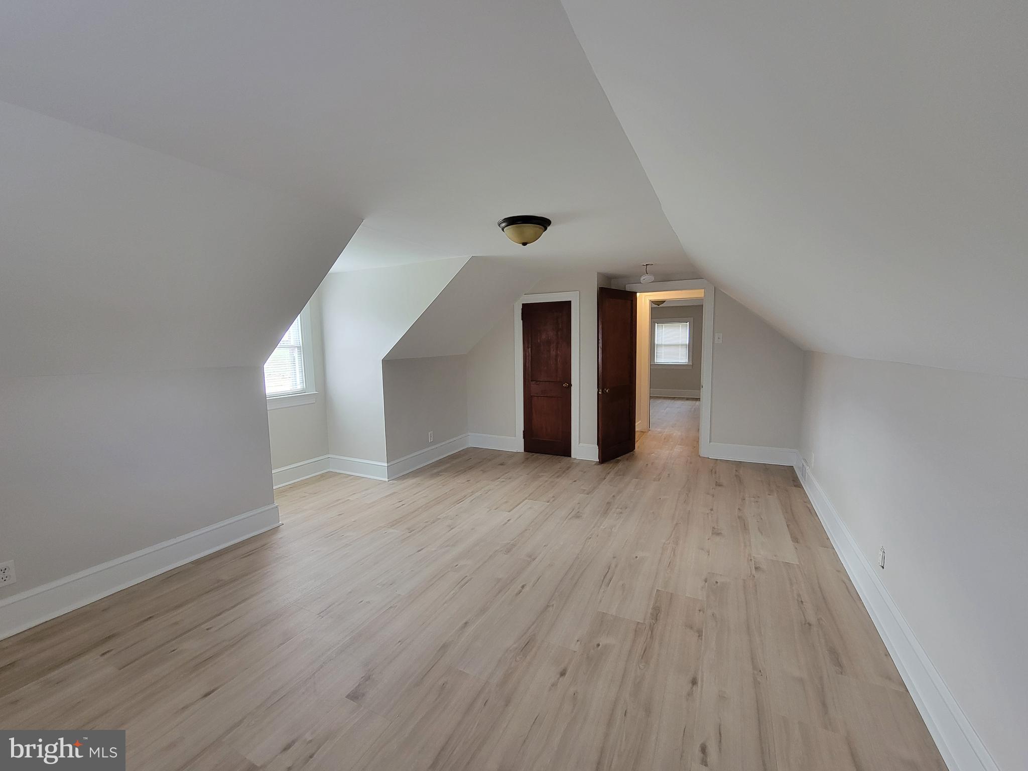 1111 Bayview Road Middletown, DE 19709 - Photo 11 of 15 a view of a hallway with wooden floor and a window