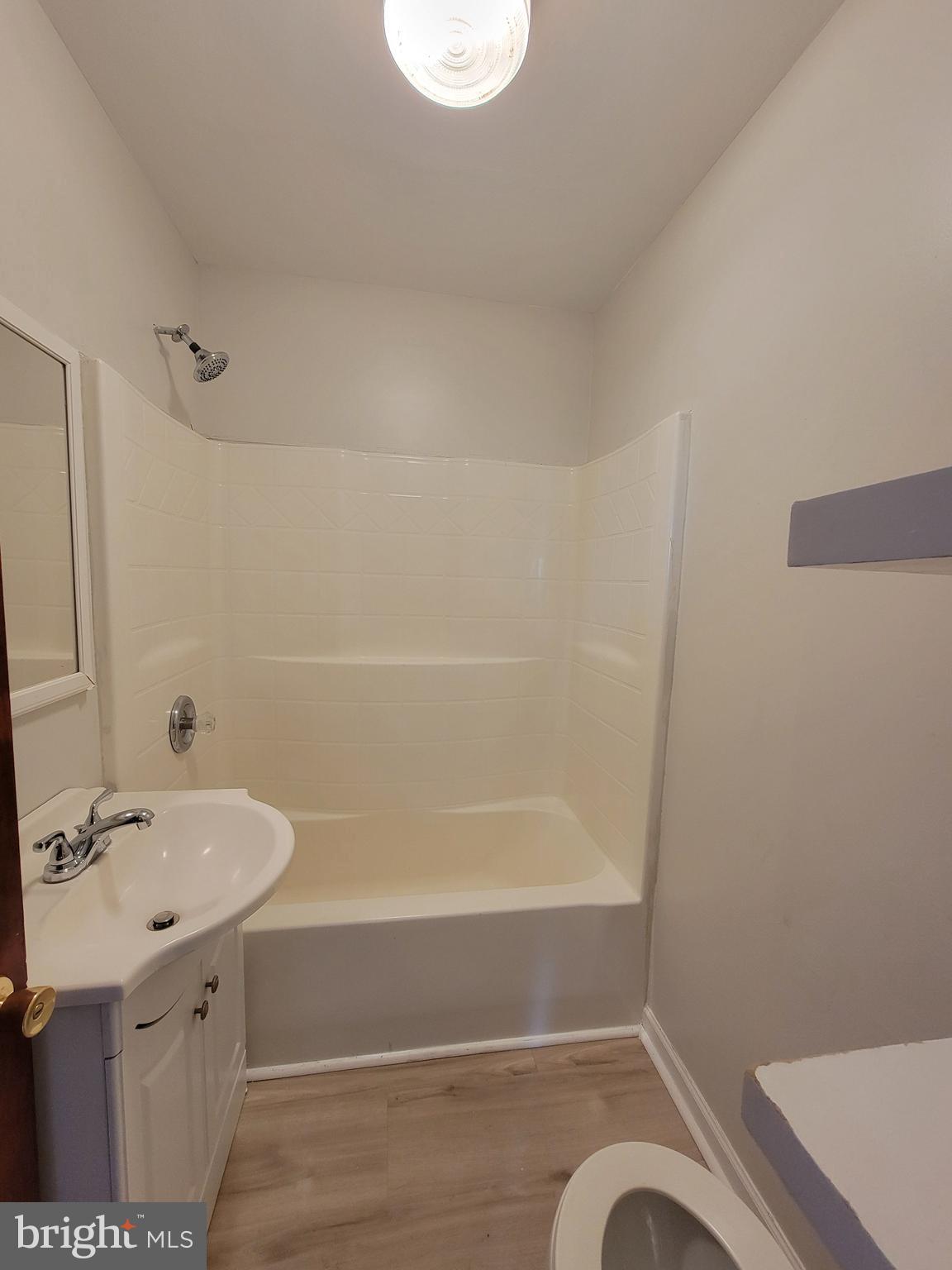 1111 Bayview Road Middletown, DE 19709 - Photo 7 of 15 a bathroom with a sink a toilet and shower