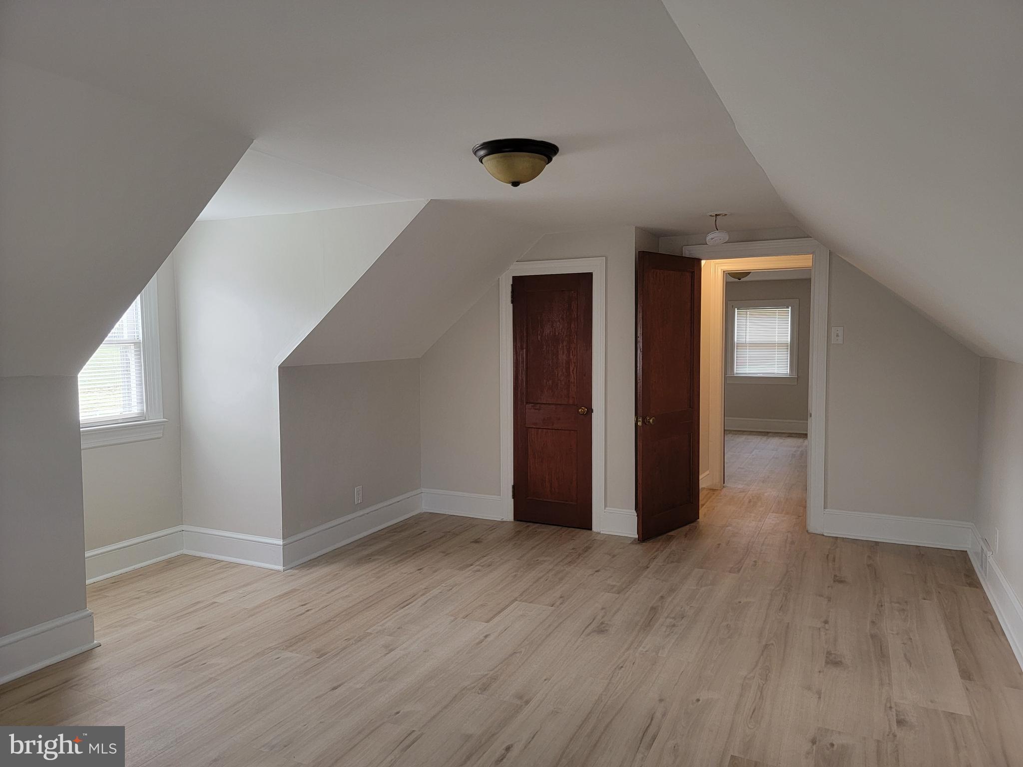 1111 Bayview Road Middletown, DE 19709 - Photo 10 of 15 an empty room with wooden floor and windows