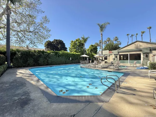 a view of a swimming pool with a patio