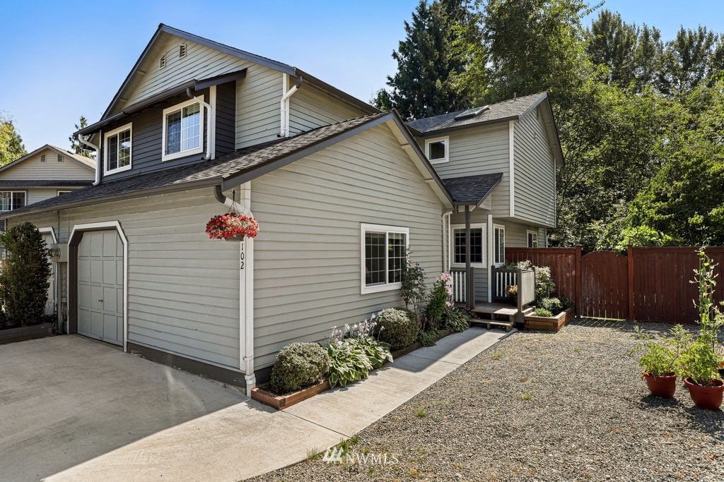 2102 186th Place Southeast Bothell, WA 98012 - Photo 1 of 31 a front view of a house with a yard
