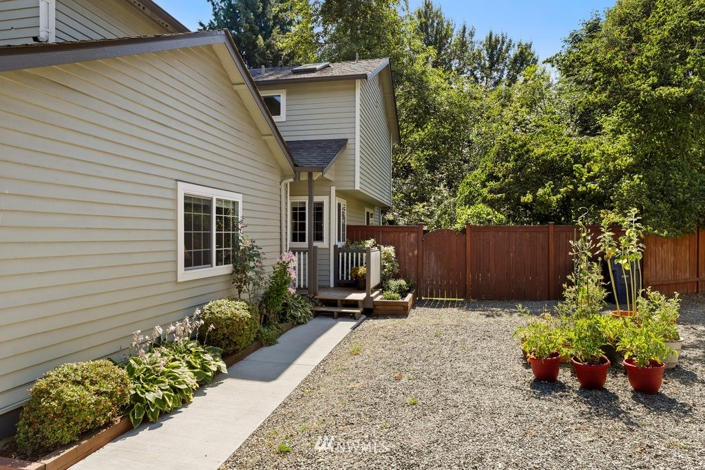 2102 186th Place Southeast Bothell, WA 98012 - Photo 2 of 31 a view of a backyard with a garden and plants