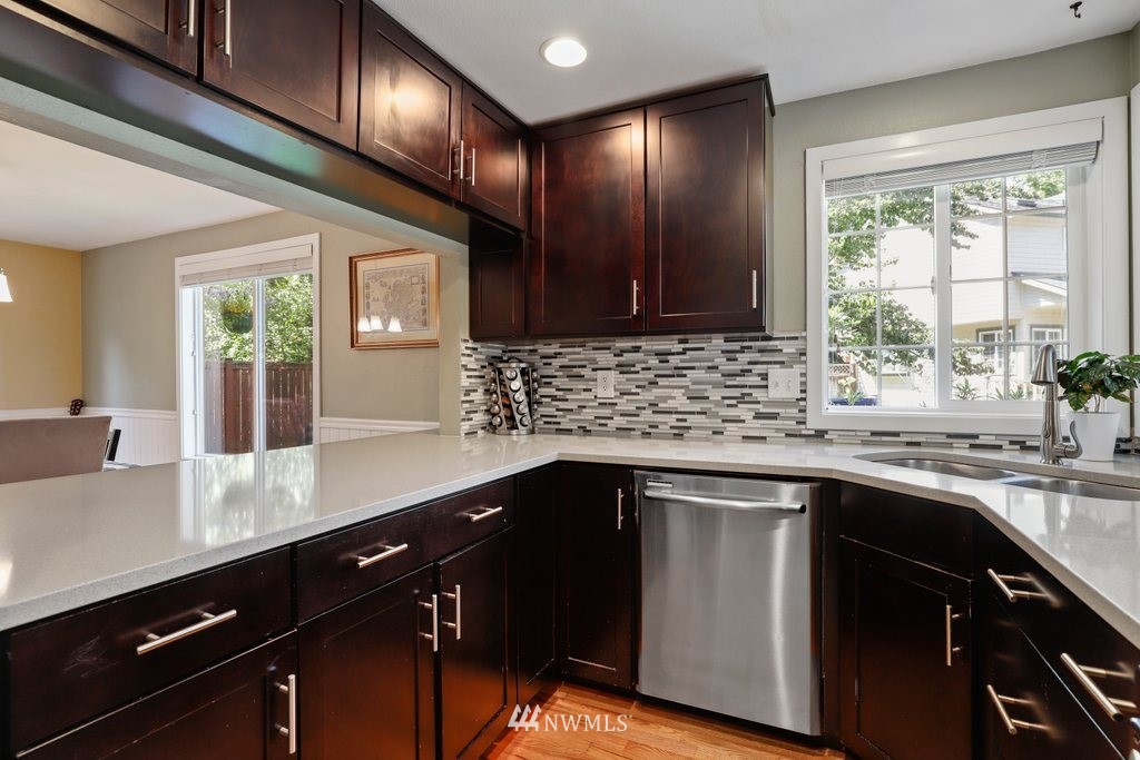 2102 186th Place Southeast Bothell, WA 98012 - Photo 13 of 31 a kitchen with a sink stove and cabinets
