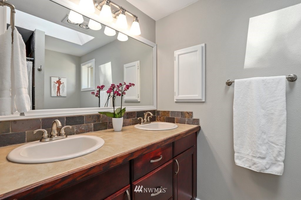 2102 186th Place Southeast Bothell, WA 98012 - Photo 19 of 31 a bathroom with a sink and a mirror
